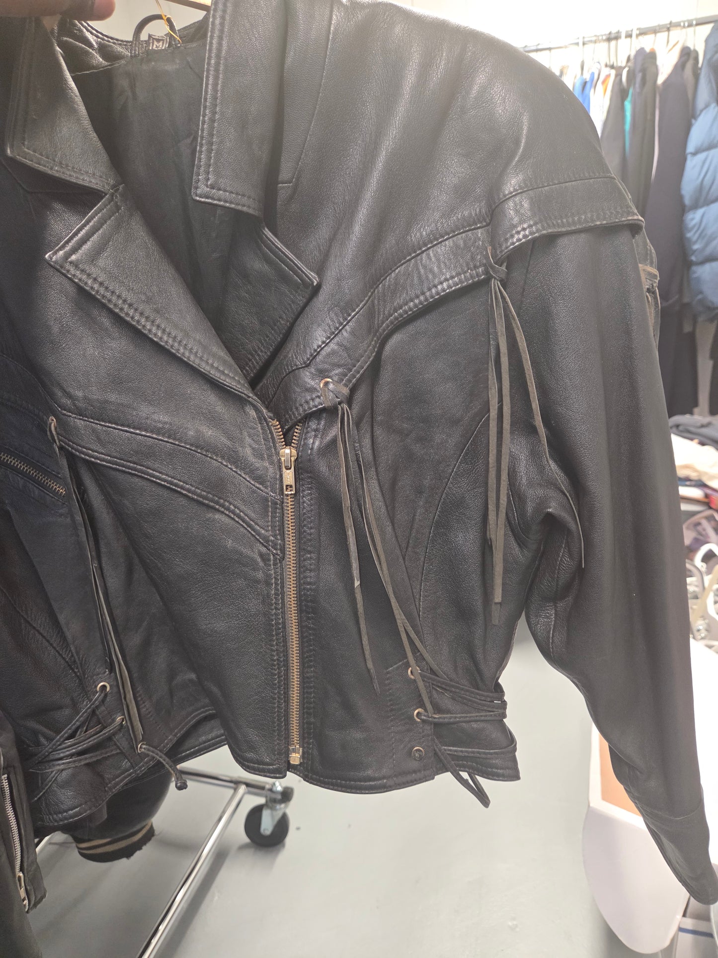 Leather jacket with tassels and adjustable waist